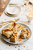 A pancake turnover filled with artichokes, mustard-fruits and rum prawns