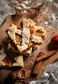 Several pieces of apple pie tray bake with cinnamon and nuts