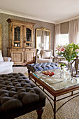 Ottoman and antique cabinet in classic living room