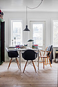 Round table and black classic chairs