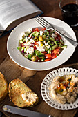 Greek salad with hummus and toasted bread
