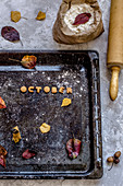 Cookies in the form of letters from which the word October is laid out on a deco with yellow leaves