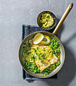 Grilled fish fillet with peas and sauce hollandaise