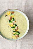 Broccoli soup with Cheddar cheese and walnuts