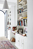 White shelf wall with books in the living room