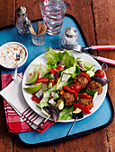 Turkey skewers with a yoghurt dip and salad