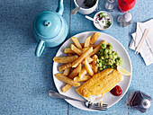 Fried fish with chips and mushy peas