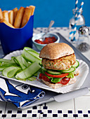 A fish burger with cucumbers