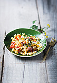Summer fusilli with blackened peppers, feta and tomatoes