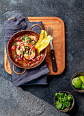 Prawn and tomato stew with plantain chips