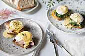 Poached eggs on toast with ham, spinach and hollandaise sauce