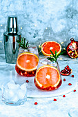 Cocktail with pomegranate seeds, grapefruit and ice