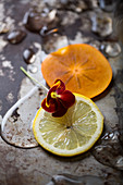 Viola, lemon and persimmon detail with spills and a metallic, rustic background