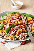 Quinoa with roasted vegetables and smoked ham