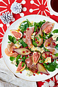 Parma ham with poached pears, figs and blue cheese