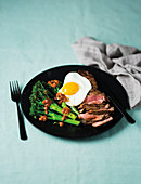 Steak with harissa broccoli stems and fried egg