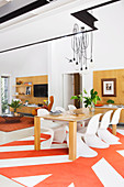 Designer chairs at the dining table in the open living room