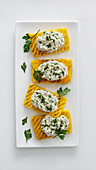 Grilled polenta slices with stockfish cream and parsley