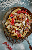 Shredded pancakes with rhubarb and redcurrants