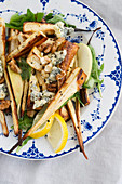 A salad with roasted parsnips, truffles, walnuts and blue cheese