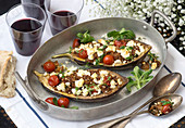 Stuffed aubergines filled minced lamb, tomatoes and feta cheese (Greece)