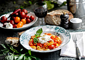 Gnocchi with tomatoes, buffalo mozzarella and basil