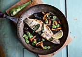 Fried fish with sage, mushrooms, beans and bacon