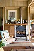 Open fireplace in living room of wooden house