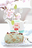 Pastel green nougat with almonds under easter decorations and cherry blossom branches