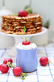 A quark dip with radishes served with spicy waffles