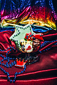 Ornate Christmas cookies (shortcrust pastries) and gingerbread on a cloth background
