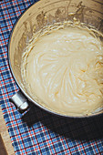 Batter (for sunken apple pie) in a mixing bowl