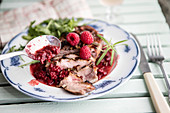 Sliced duck breast with raspberries, Szechuan pepper and rosemary