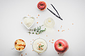 A layered dessert with apple ragout, vanilla cream, white wine and thyme