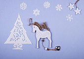 Sweet Christmas tree made of icing, wooden hors, icing snowflakes