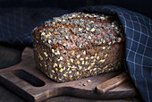 Loaf of tasty fresh baked rye bread with seeds
