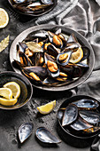 Tasty baked mussels served with lemon