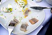 Leftover herring dishes on a plate