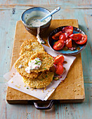 Celeriac schnitzel with cheese sauce and tomato salad