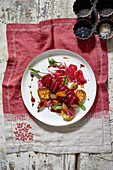 Beetroot spaghetti with herb mushrooms and ricotta biscuits