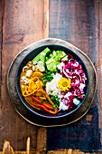 A Buddha bowl with vegetables and rice