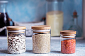 Quinoa, beans and lentils in jars