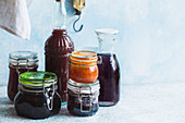 Jars of various homemade jams and beverages