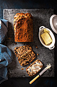 Dried fruit, chai tea infused tea loaf with butter on a side