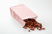 Roasted almonds in a paper cone
