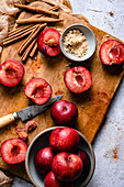 Sliced Red Plums on a wooden chopping board