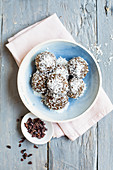 Vegan flaxseed energy balls with hemp and grated coconut