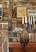 Magnetic strip with knives on a rustic wooden wall
