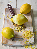 Lemons being grated for lemon zest