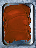 Caramel spread on a baking sheet